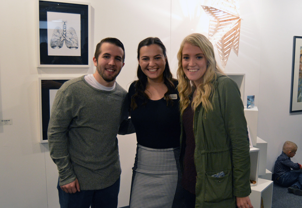 Hannah Avdoulos poses at the Lansing Art Gallery with friends